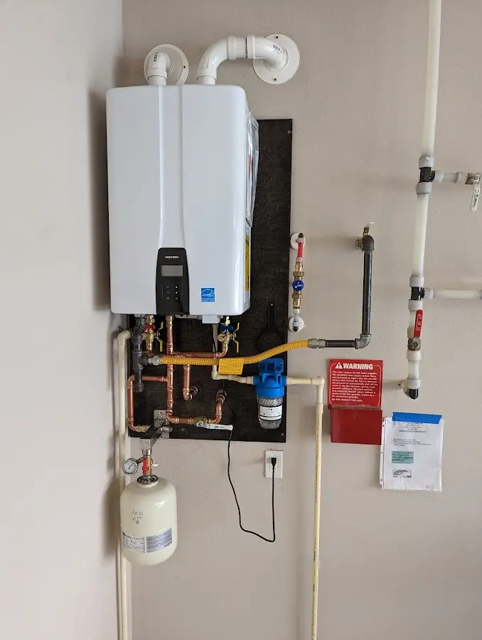 Professional plumber installing copper piping in a Social Circle home